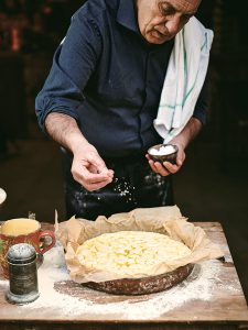 Gennaro's Italian Bakery: salting focaccia